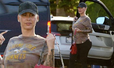 Amber Rose cuts a casual figure in camouflage print top